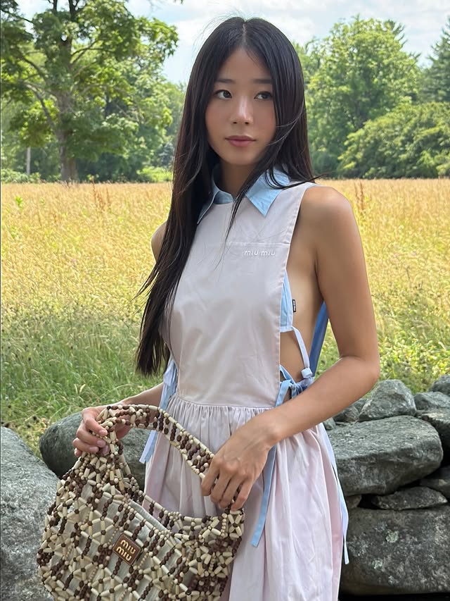 Instagram post by @hjevelyn for Miu Miu. Caption reads: east coast summer in @miumiu #MiuMiuEte #MiuMiu....
