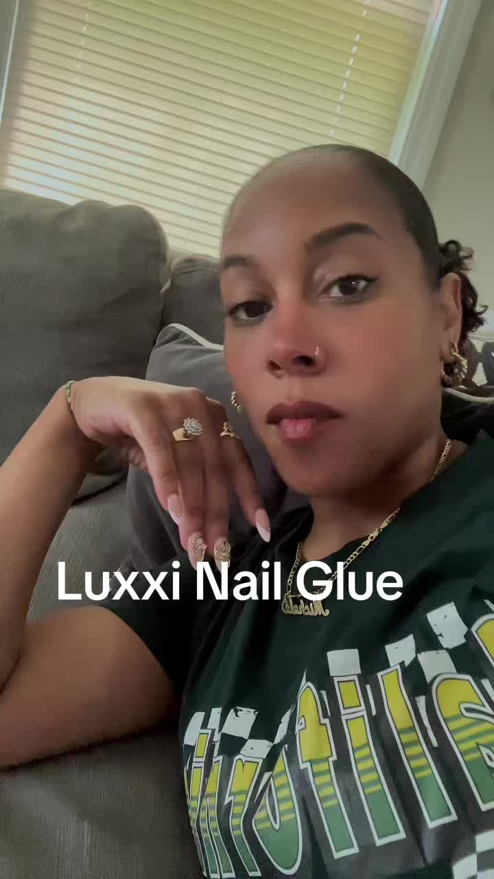 TikTok post by @cleancalmrelaxcleaning for Luxxi Nails. Caption reads: [...] might be my new favorite nail glue @LUXXI....