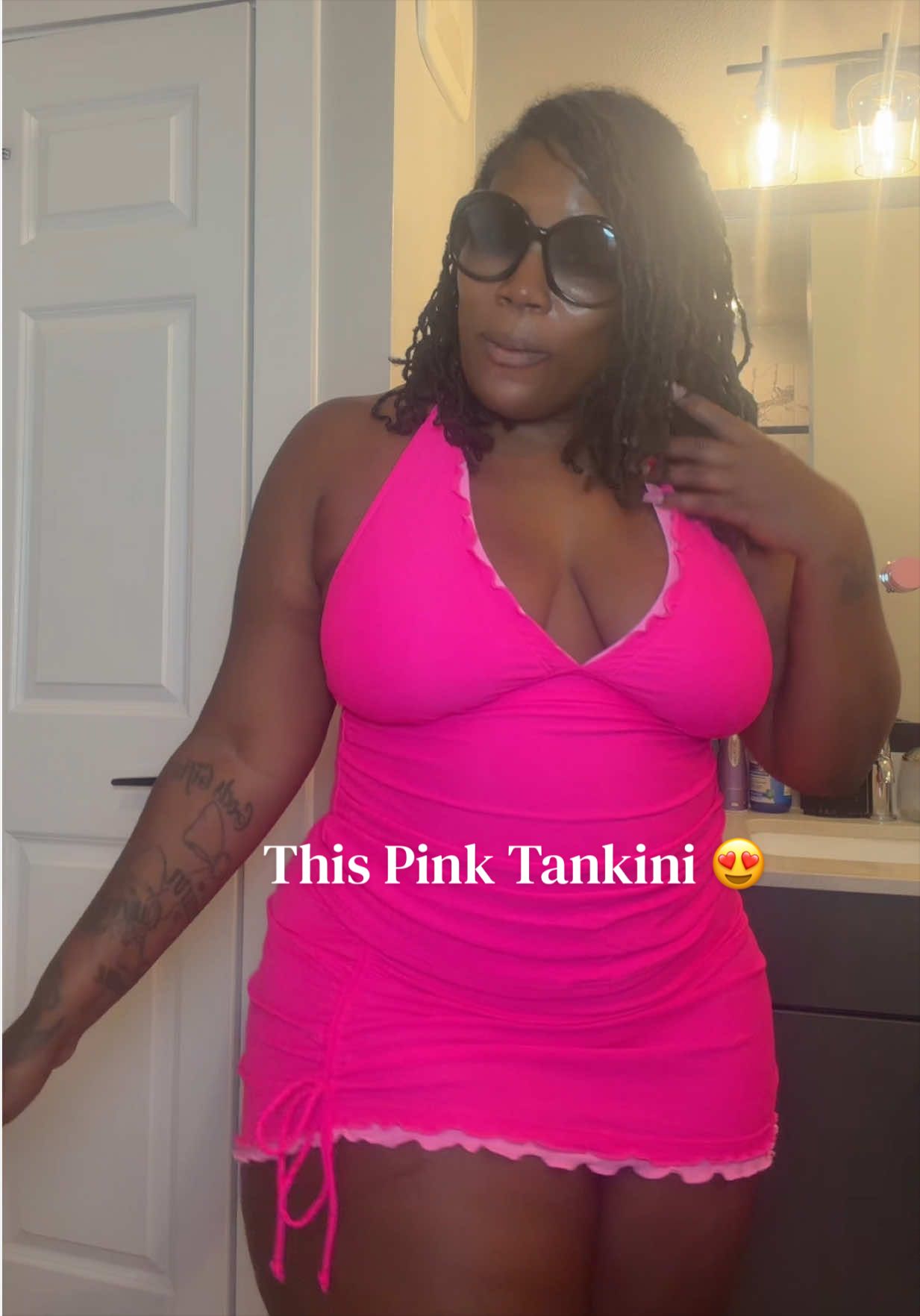 TikTok post by @sheisleticia for Tempt Me Swimsuits. Caption reads: [...] tap the orange shopping cart. 🛍️ @Tempt Me....