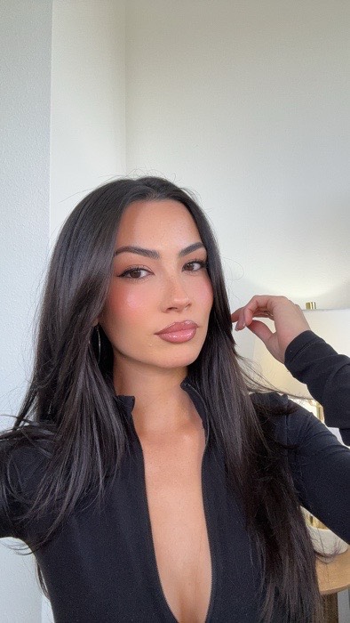 Instagram post by @isarahbutler for Prada Beauty. Caption reads: I’m LOVING all of these products already....