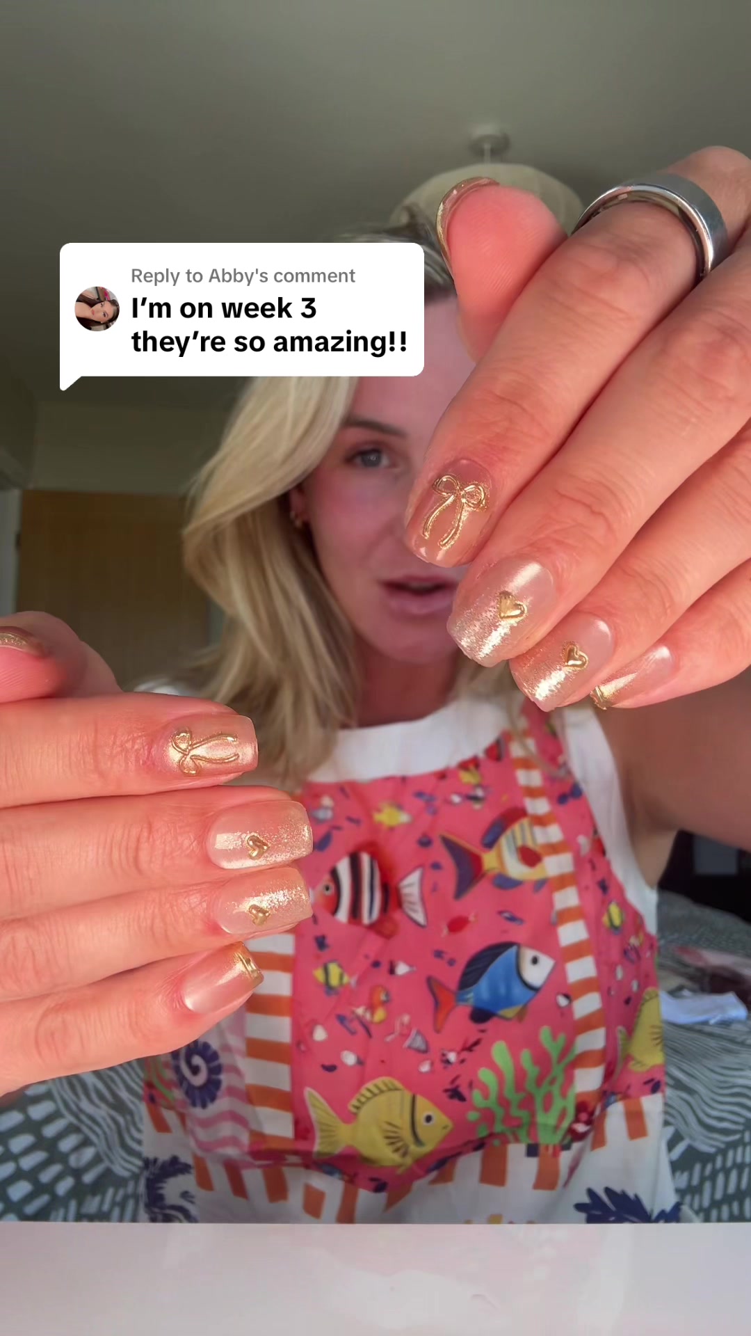 TikTok post by @emmatwinmum for Ellie Young Beauty Shop. Caption reads: Replying to @Abby the press on nails that last....