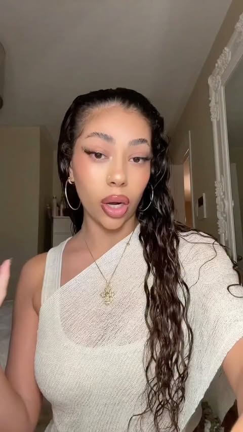 Instagram post by @emily.demian for K18 Hair. Caption reads: The year I stopped fighting my curls and started....