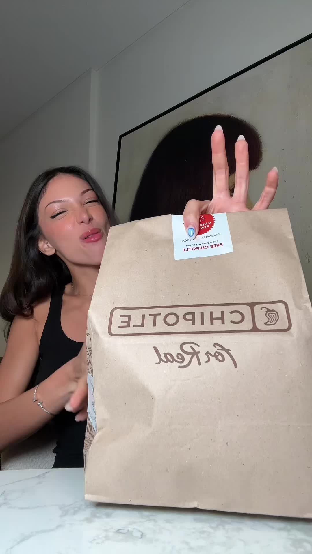 TikTok post by @taliaafawaz for talabat. Caption reads: Chipotle is my lifeeeee @Talabat #talabatuae 🤟🏽.