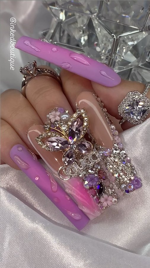 Instagram post by @nailzbyrissxo for Bluestreak Crystals. Caption reads: [...] 🌸💜

Products used....
