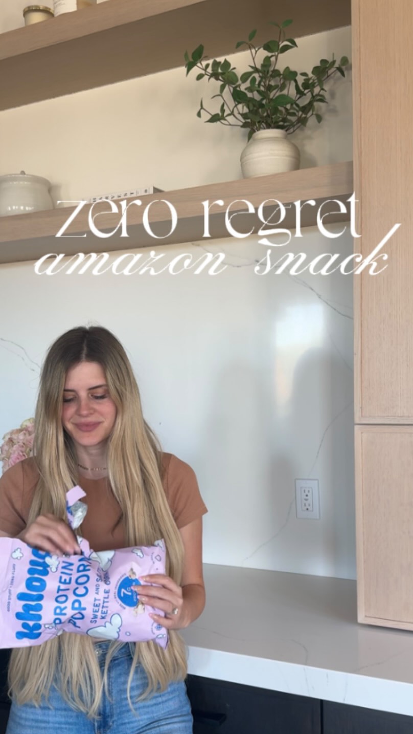 Instagram post by @thesunkissedlife_ for KhloudFoods. Caption reads: follow, then comment “SNACK” for a dm💌🍿🎀....