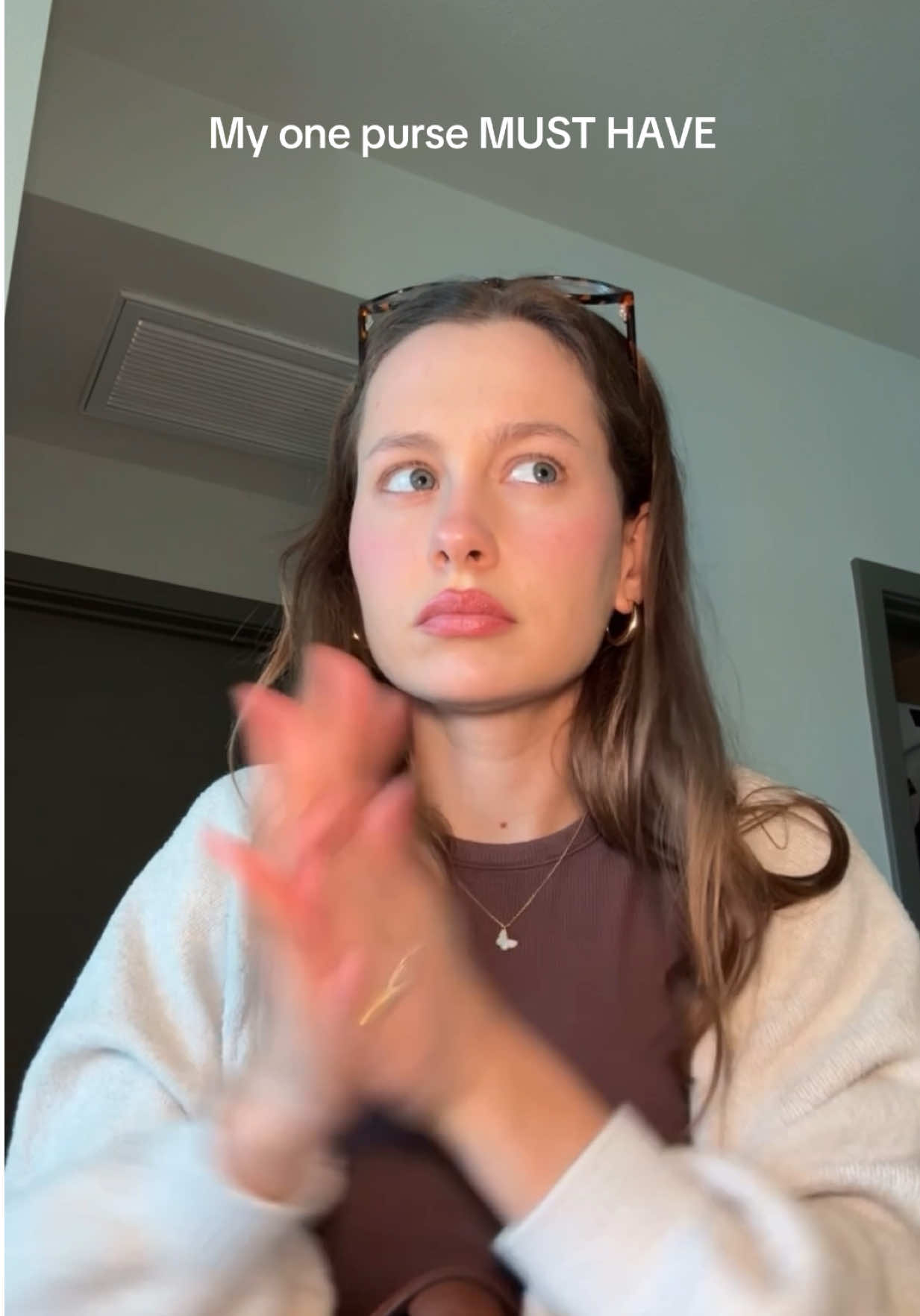 TikTok post by @natashaperry for Touchland. Caption reads: [...] is just TOOO GOOD! My purse must have-....
