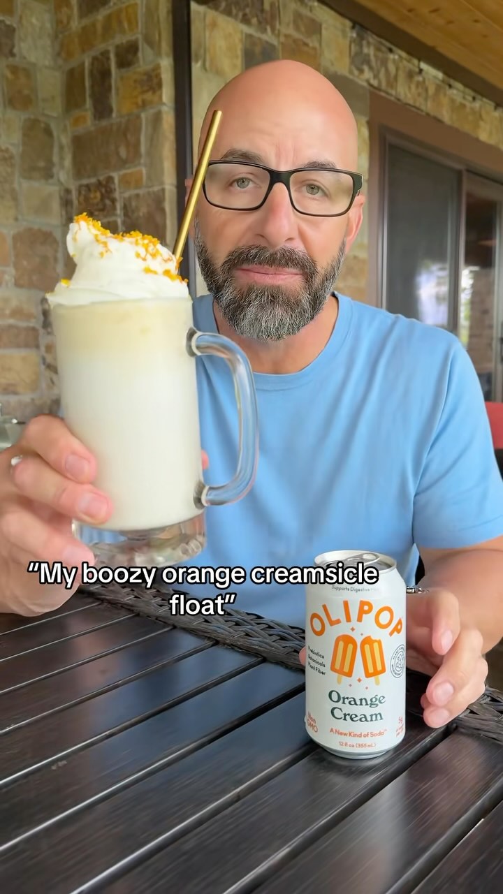 Instagram post by @johnnydrinks_ for OLIPOP. Caption reads: [...] oz vodka
1/2 can Orange Cream Olipop
Top w/....