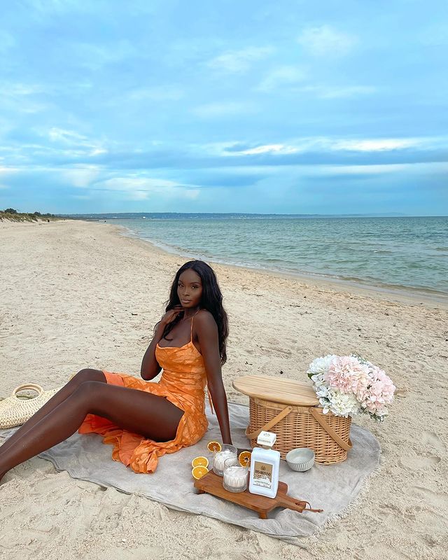 Instagram post by @nikkithot for Disaronno. Caption reads: Soft life please 🥰 enjoyed the prettiest picnic....