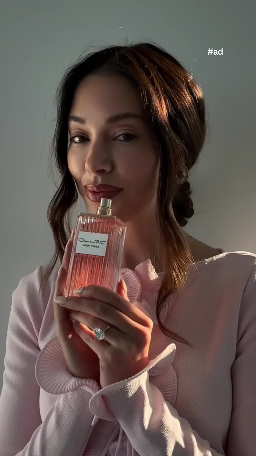 TikTok post by @jourdansloane for Oscar De La Renta. Caption reads: [...] rose, and vanilla, the new Oscar de la Renta....