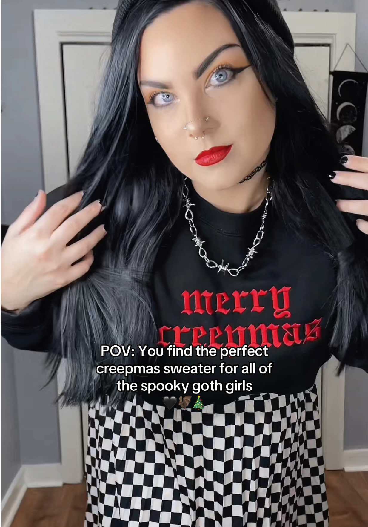 TikTok post by @nikkidrinkscraft for In Stitches Apparel. Caption reads: [...] my festive spooky goth girls from @In....