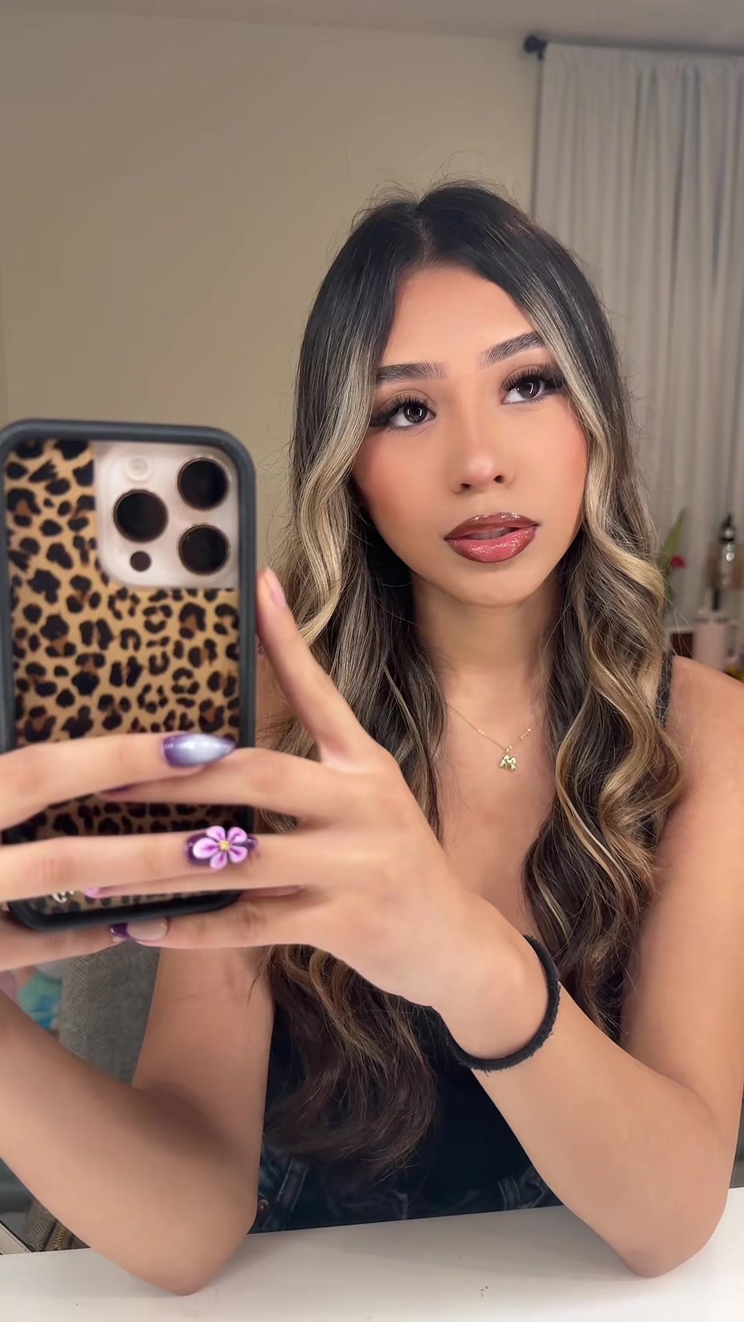 TikTok post by @mayahr1013 for Wildflower Cases. Caption reads: 🐆🥂💋🤍@Wildflower Cases.