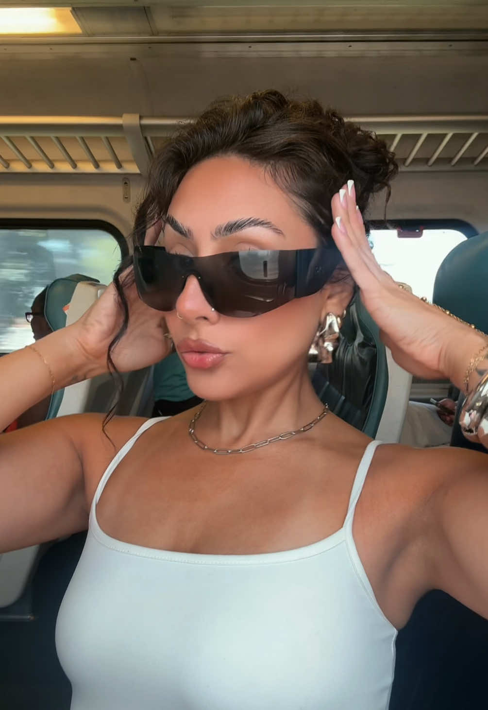 TikTok post by @tatiismamii for DEZI. Caption reads: accessories are the fit 💅🏽✨ @DEZI EYEWEAR.
