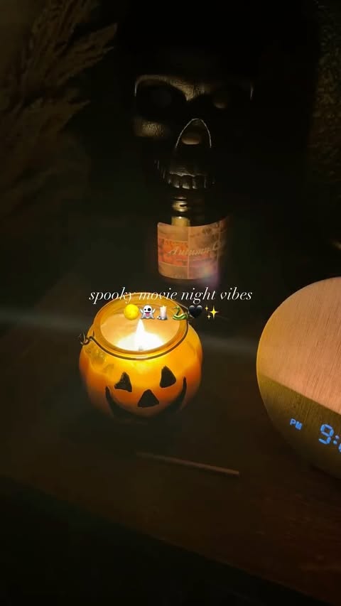 Instagram post by @the.cozyy.bookworm for Pococo. Caption reads: Spooky movie night vibes with @pococo_store 🖤✨🕯️....