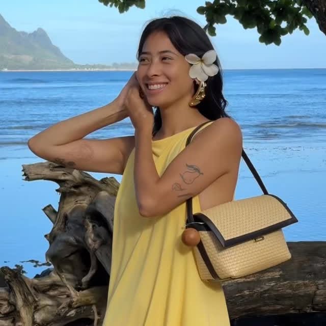 Instagram post by @himichelleli for FARFETCH. Caption reads: 12 beautiful hours in Kauai with the most perfect....