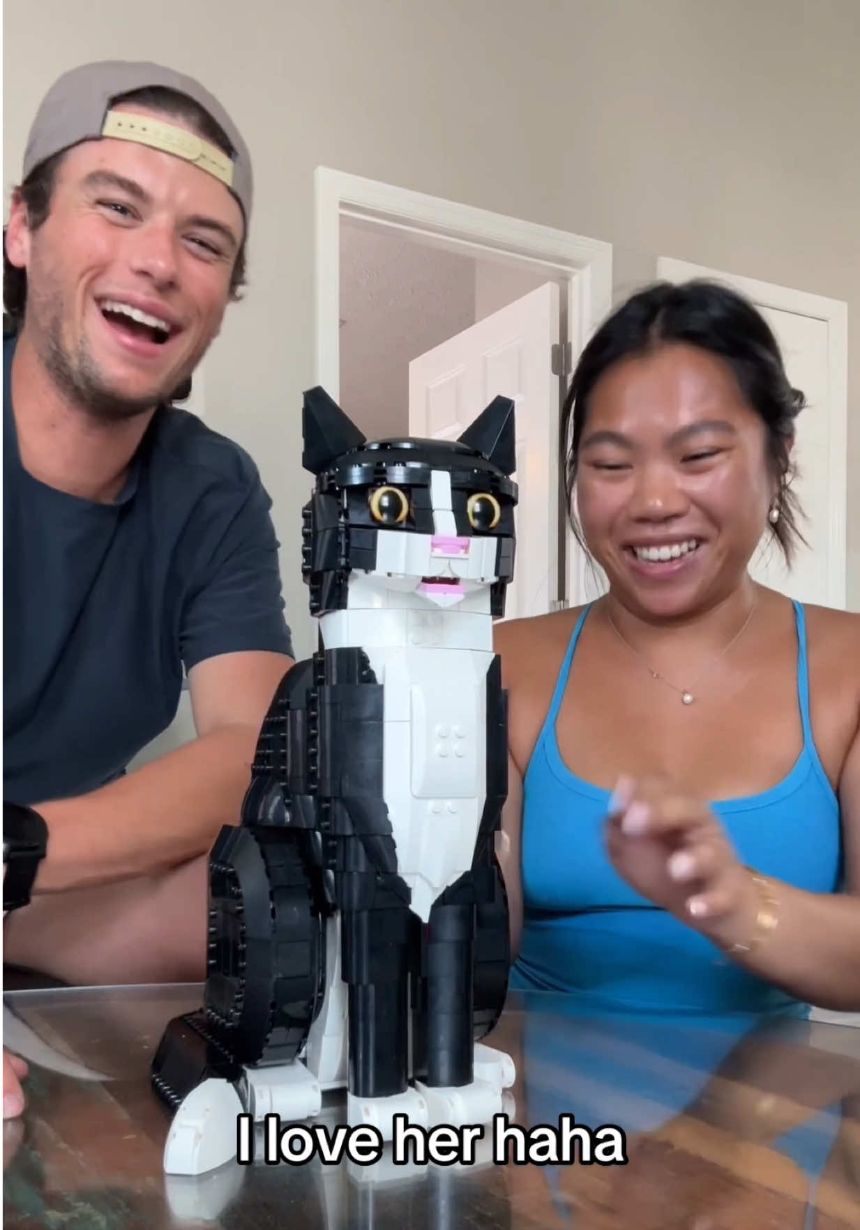 TikTok post by @meimonstaa for LEGO. Caption reads: so my brother secretly had a cat living with us 😅....