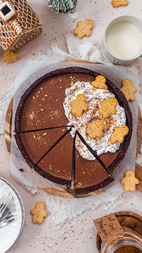 Instagram post by @nourishing.amy for Biomel. Caption reads: Chocolate Gingerbread Ganache Tart 🍫🎄
Rich and....