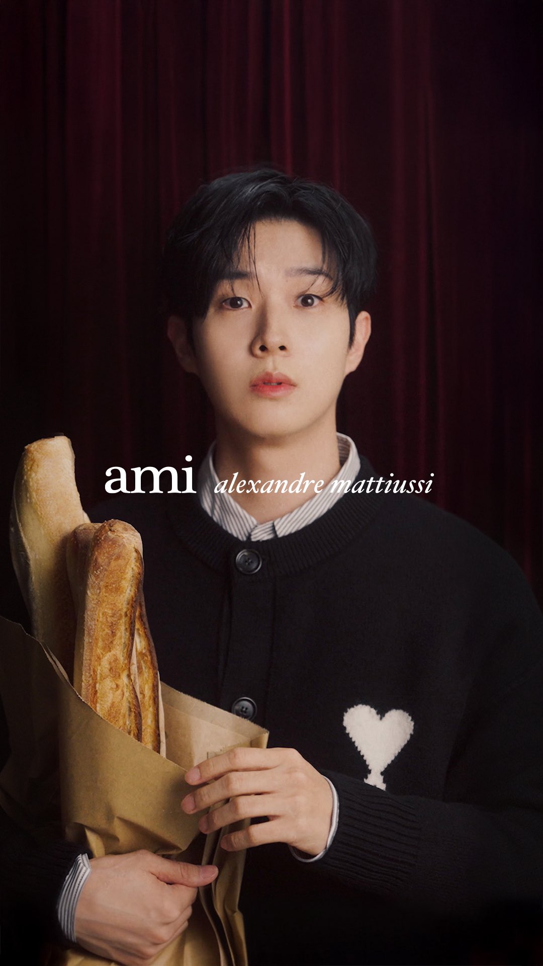 Instagram post by @dntlrdl for AMI Paris. Caption reads: [...] 이룹니다. 오랜 친구처럼 자연스럽게, 아미 파리(@amiparis)와 최우식이....