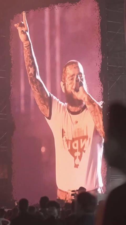 Instagram post by @bookmyshow.live for BookMyShow. Caption reads: @postmalone paying tribute to the legendary Zubeen....