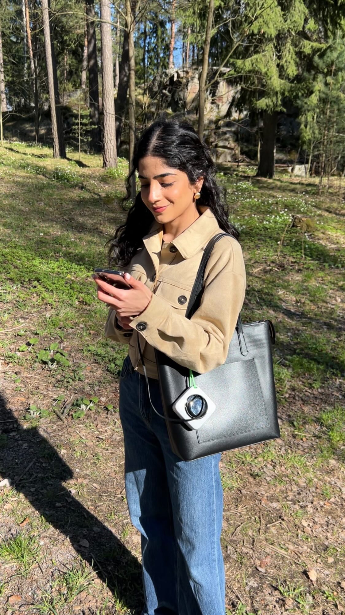 Instagram post by @manalaijaz for FansDreams. Caption reads: [...] like just another bag accessory 👜⚡️....