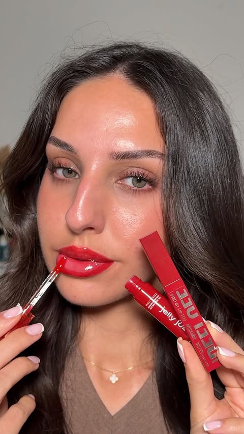Instagram post by @naomimizrahi for LOOKFANTASTIC. Caption reads: [...] job gloss “ cherry jelly” Shop at....