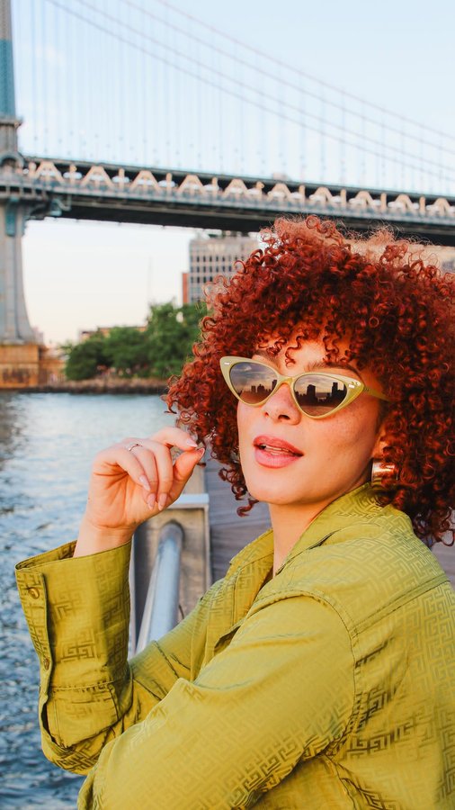 Instagram post by @travelingwithjessica for Function of Beauty. Caption reads: Beautiful curls, uniquely yours, no matter where....