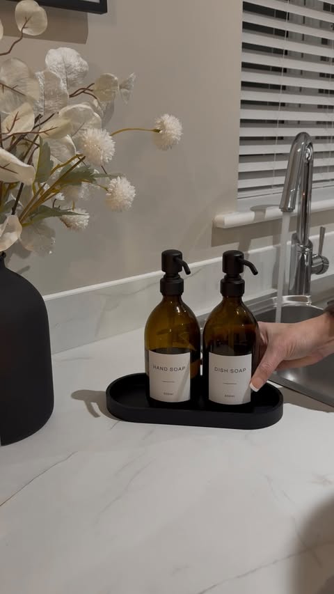 Instagram post by @casa_morwil for NAMIE HOME. Caption reads: [...] with matte black dispensers from @namiehome....