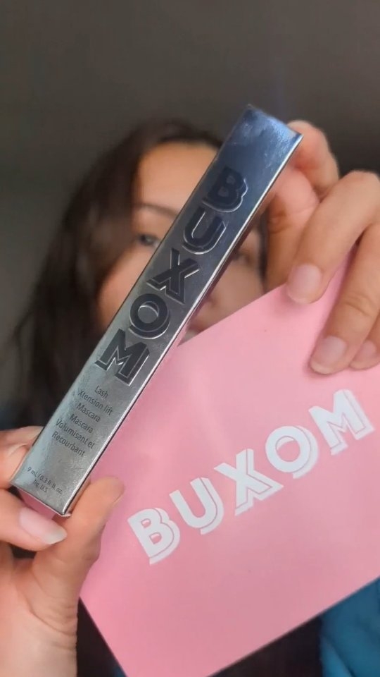 Instagram post by @ayrgalaxy for BUXOM Cosmetics. Caption reads: [...] lash extensions in a bottle! 🖤 🤩....