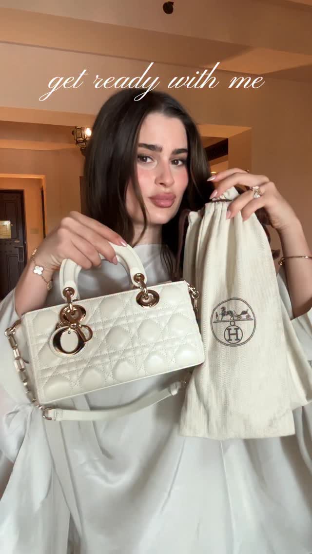 Instagram post by @reem_almajed7 for Massimo Dutti. Caption reads: fav outfit from abu dhabi @massimodutti.