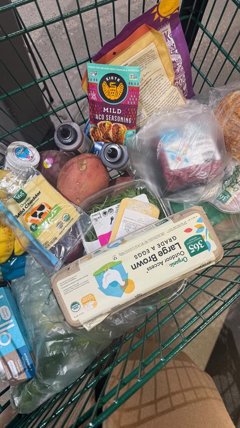 Instagram post by @ellie_teale for Whole Foods Market. Caption reads: @wholefoods grocery shopping vlog 🫐 

#dailyvlog....