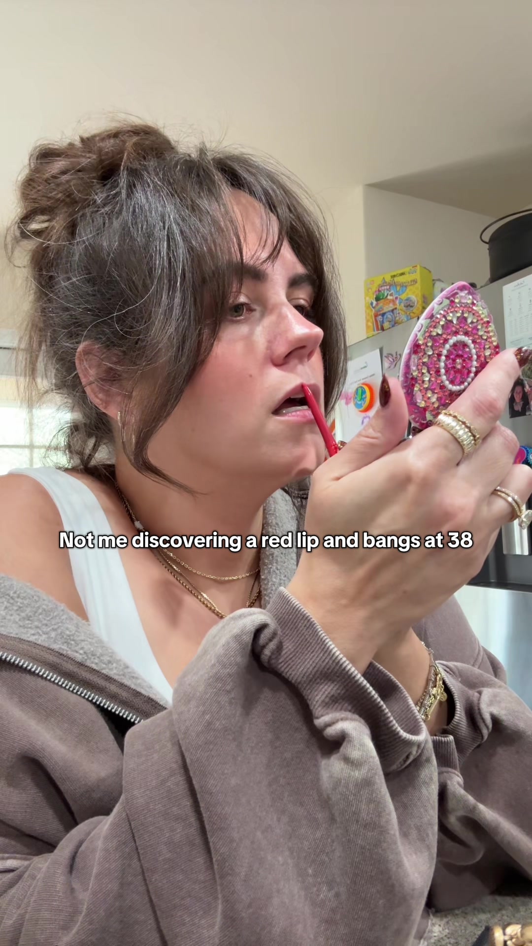 TikTok post by @itslindss for Revlon. Caption reads: I’m 38 years old and I just now discovered bangs....