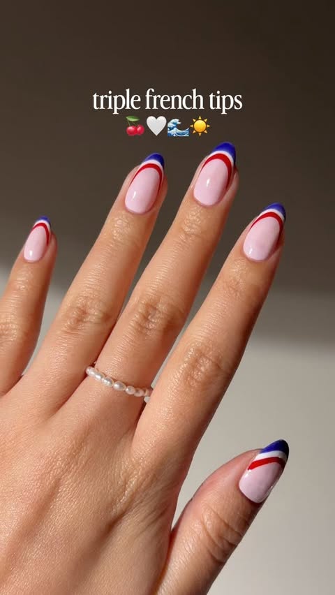 Instagram post by @bycheznails for ella+mila. Caption reads: [...] french tips, triple the fun! 💙🤍❤️ad....