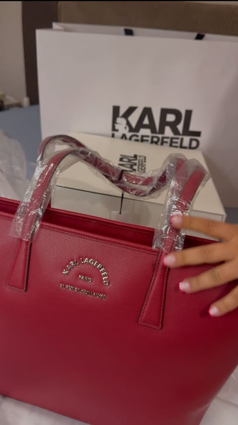 Instagram post by @thepoojasblog for KARL LAGERFELD. Caption reads: Is world really loosing color or running behind....