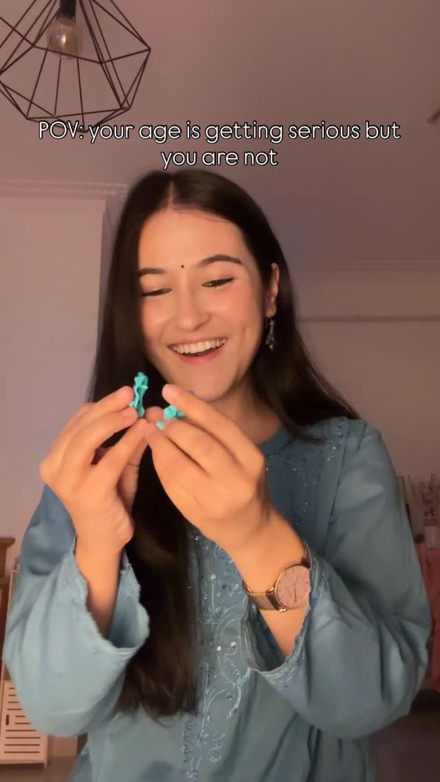 Instagram post by @binita_budathoki for Kinder. Caption reads: Things I buy with my adult money and I know you do....