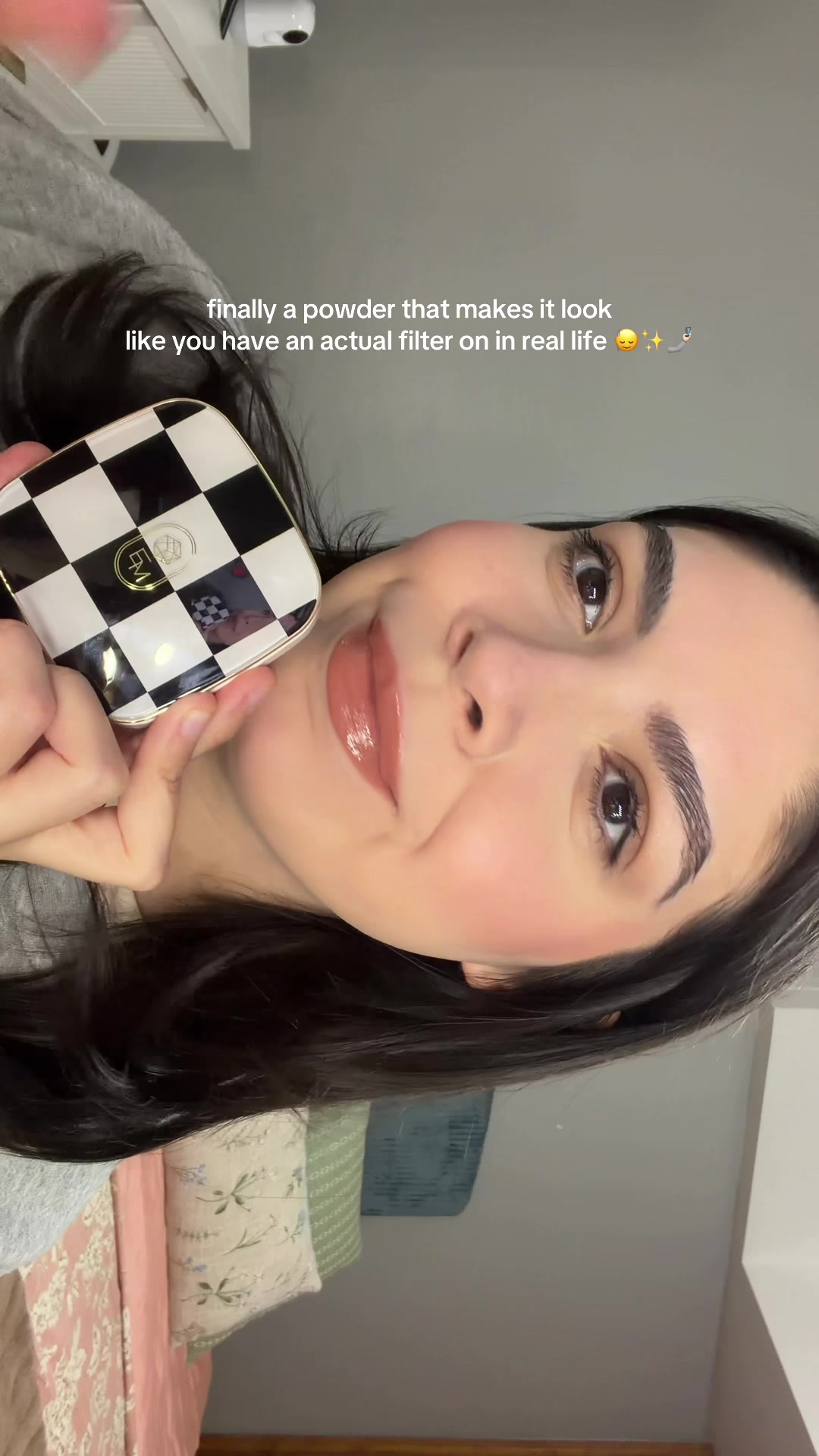 TikTok post by @angelahlxo for EM Cosmetics. Caption reads: [...] it gets rid of my pores & shine?? @EM....