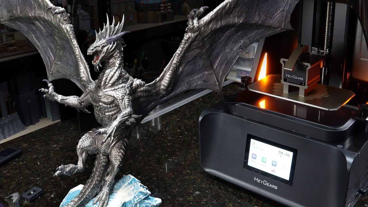 YouTube post by @WylochsArmory for MyMiniFactory. Caption reads: ENORMOUS Ancient Silver Dragon -- and so much....