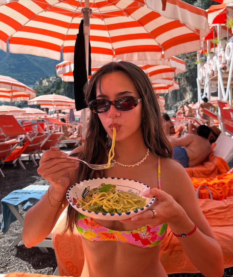 Instagram post by @lanipliopa for Bright Swimwear. Caption reads: if a beach was aperol themed.