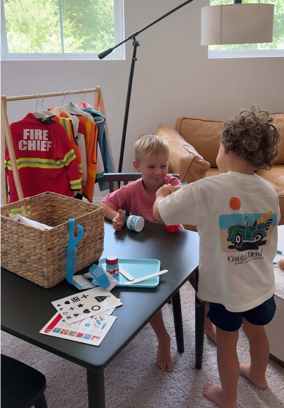 TikTok post by @thebrittkit for Melissa & Doug. Caption reads:  #ad setting up pretend-play stations in our....