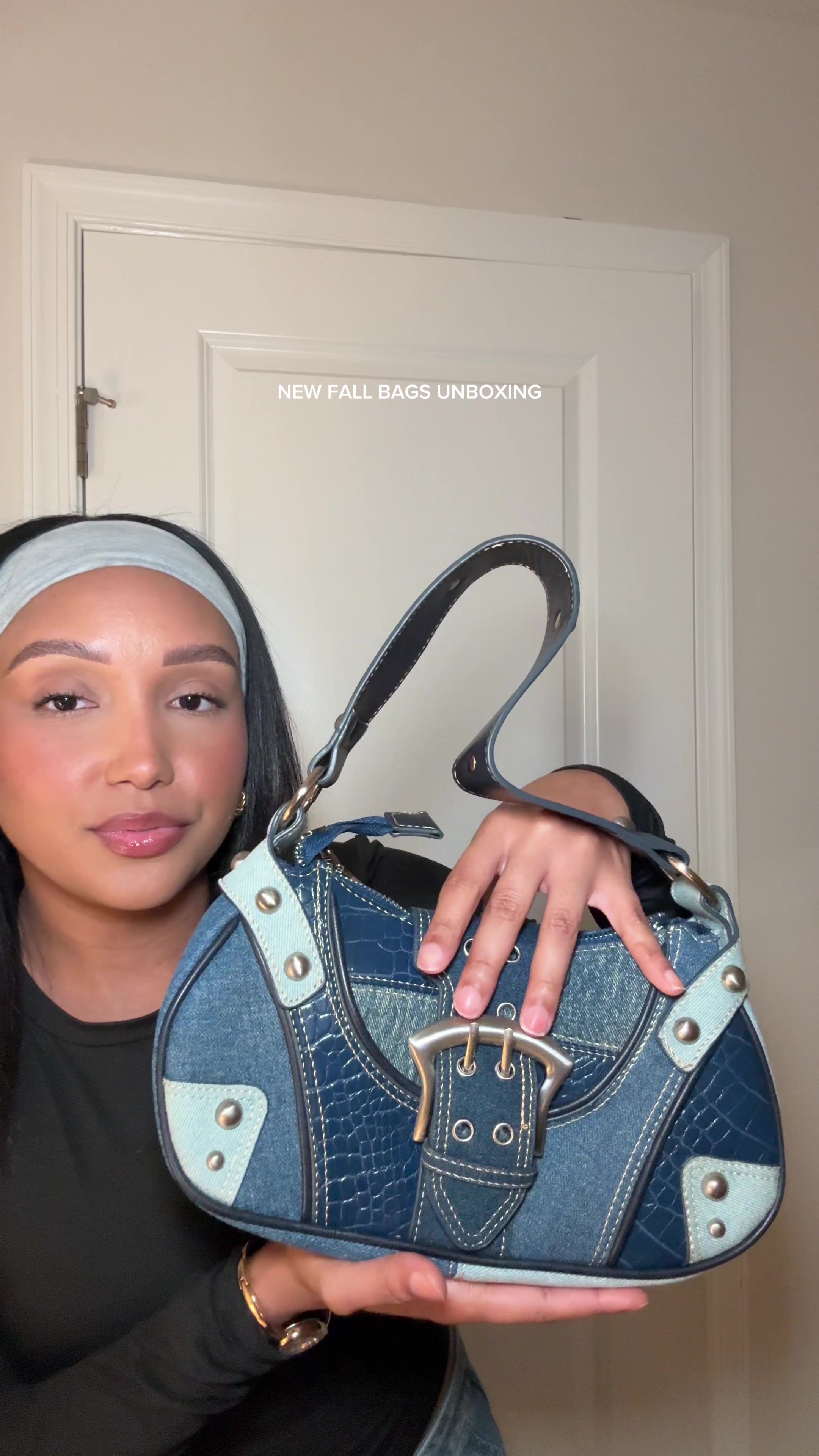TikTok post by @alexisxbell for Dolls Kill. Caption reads: Unboxing my new bags from @Dolls Kill and I’m so....