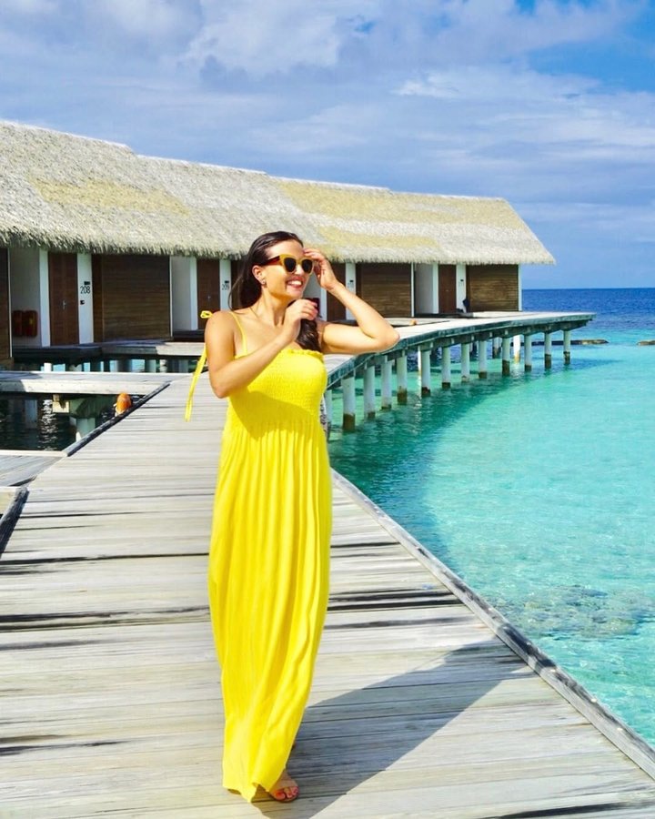 Instagram post by @spaitgirl_travel for Small Luxury Hotels. Caption reads: I am Always Happy When Visiting The Maldives &....