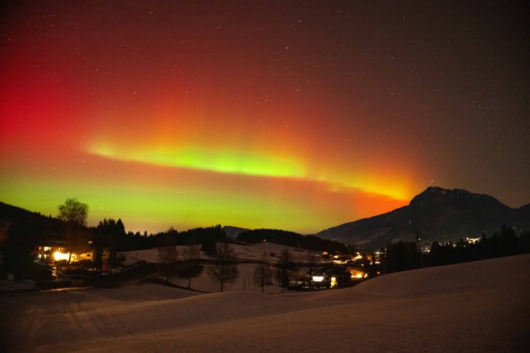 Instagram post by @iambastiano for Peak Design. Caption reads: northern lights above the allgäu 🥹 thankful for....