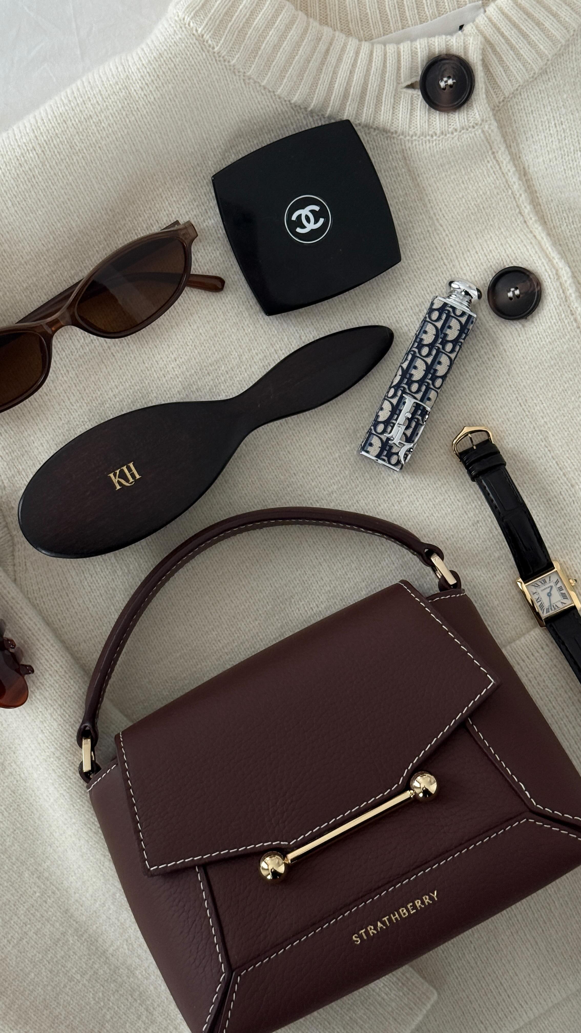 Instagram post by @kateehutchins for Strathberry. Caption reads: The perfect bag for autumn doesn’t exi… the....