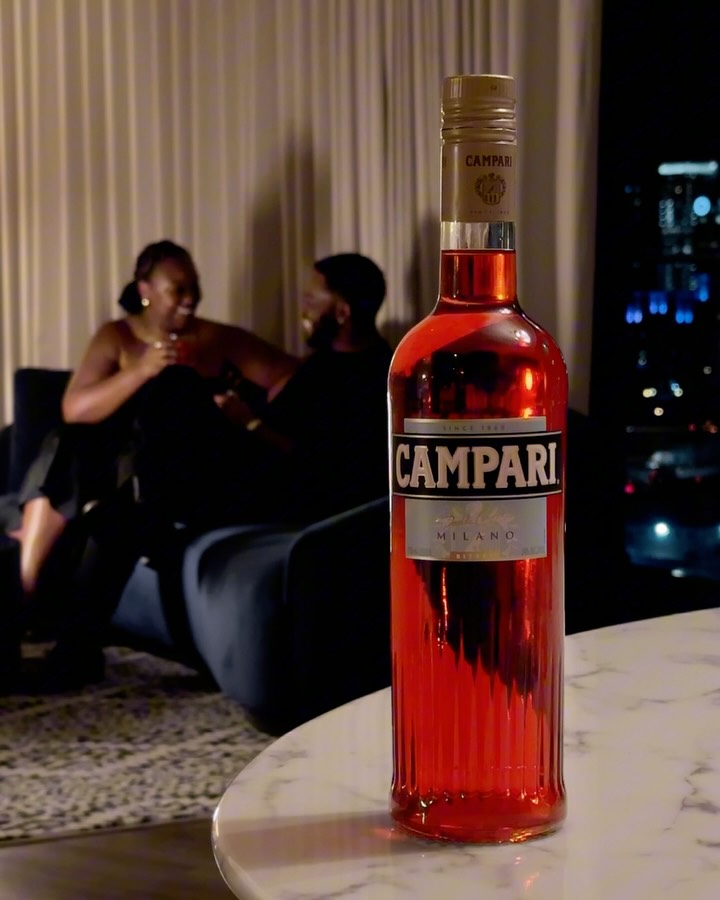 Instagram post by @devanondeck for Campari. Caption reads: #ad21 Sipping on a @campariofficial Negroni &....