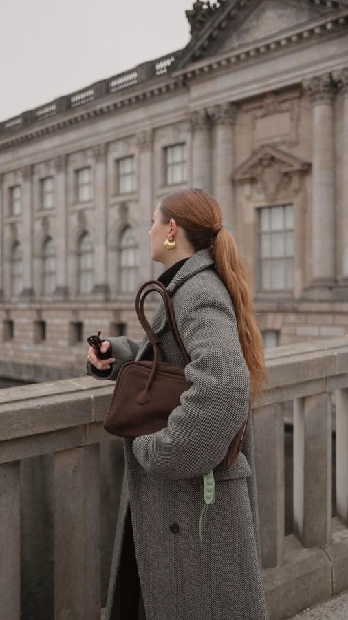 Instagram post by @marie.schoeniger for Le Specs. Caption reads: // whoever said you can’t wear black and brown....