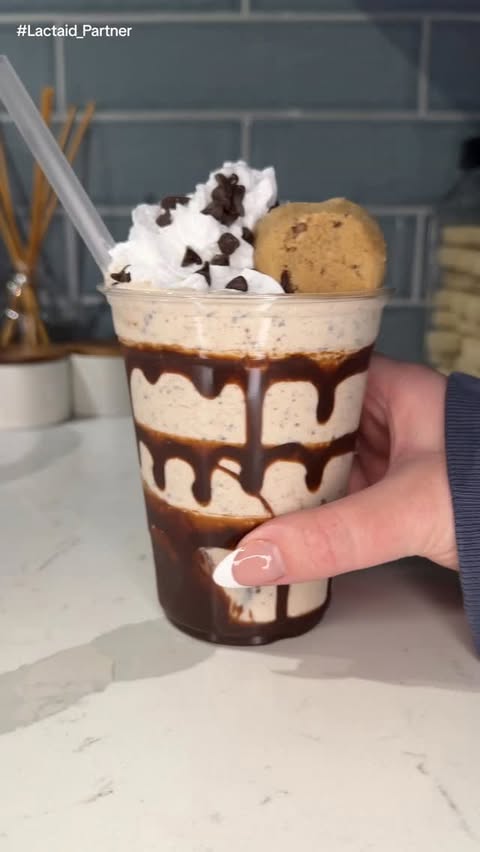 Instagram post by @ashleymarkletreats for LACTAID. Caption reads: this @lactaid cookie dough milkshake is 100% real....