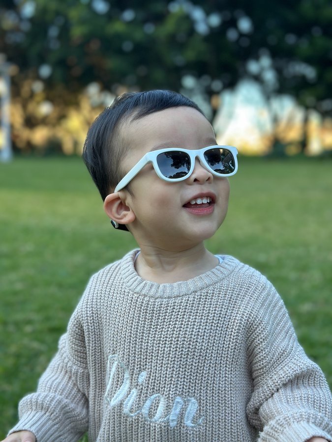 Instagram post by @metier.social for Polarised Baby Sunglasses. Caption reads: We absolutely love our BukiBaby Baby B Shades! The....