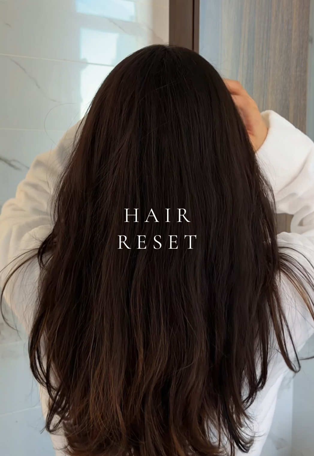 TikTok post by @elysian.living for Eva NYC. Caption reads: [...] my hair from root to tip ✨ using @Eva NYC....