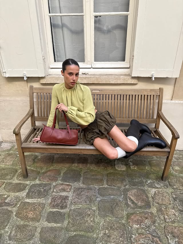 Instagram post by @maina for Longchamp. Caption reads: in my own little world 🎠🌟 @longchamp....