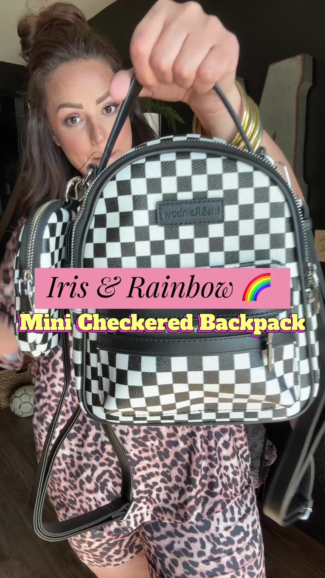 TikTok post by @_.andrea.nicole._ for Iris And Rainbow. Caption reads: Checkered Mini Backpack @Rainbow Boutique LLC....