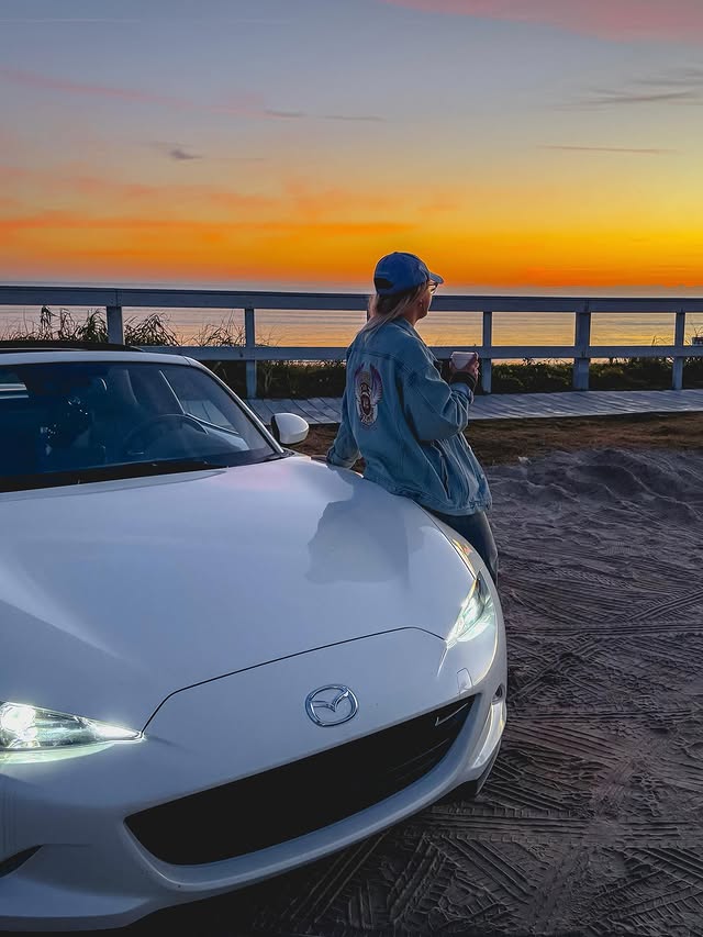 Instagram post by @noisybutters for Mazda USA. Caption reads: am i doin this car person thing right? 🌴🌅.