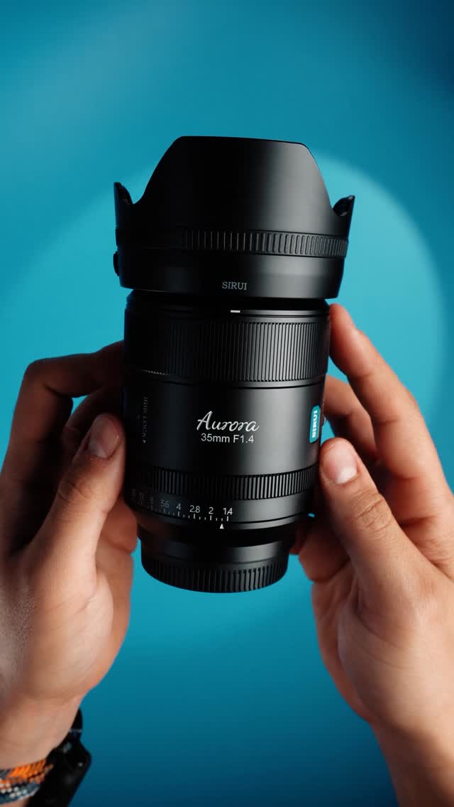 Instagram post by @visualmotions for SIRUI Imaging. Caption reads: #UNBOXING THE SIRUI AURORA 35mm f1.4 Music by....